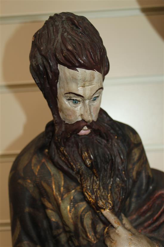 A 20th century carved and polychrome painted figure of a Saint, 31in.